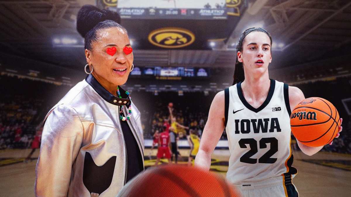Dawn Staley with heart eyes looking at Caitlin Clark
