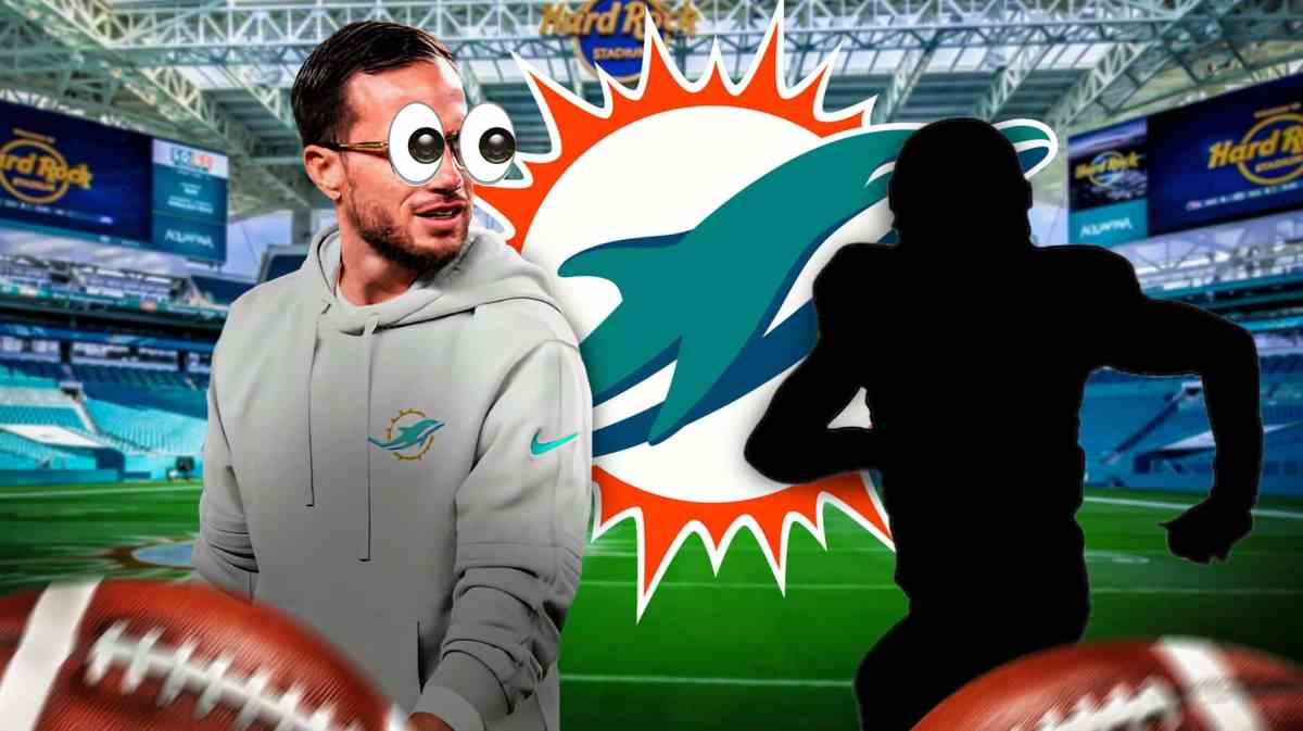 Mike McDaniel with emoji eyes looking at a silhouette
