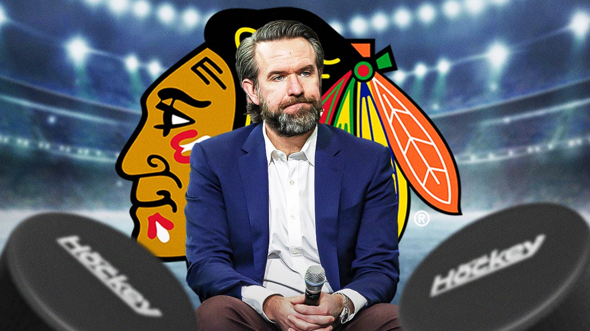Chicago Blackhawks owner Danny Wirtz with a logo for the Chicago Blackhawks.