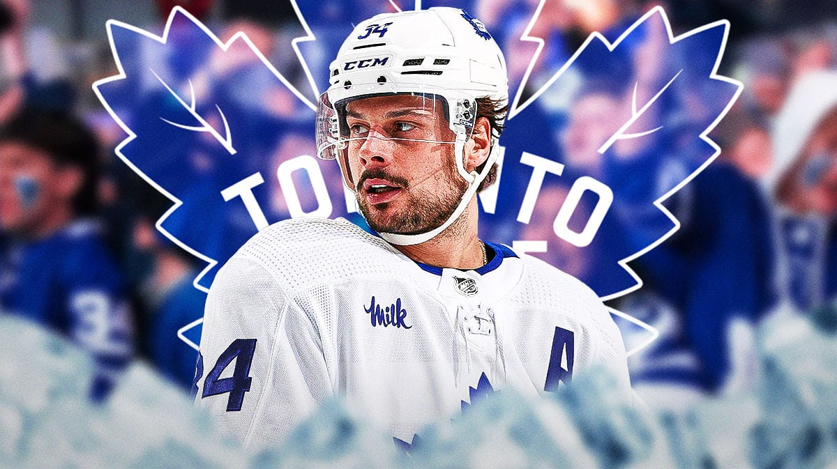 Maple Leafs' center Auston Matthews, frustrated, with fans in the background.