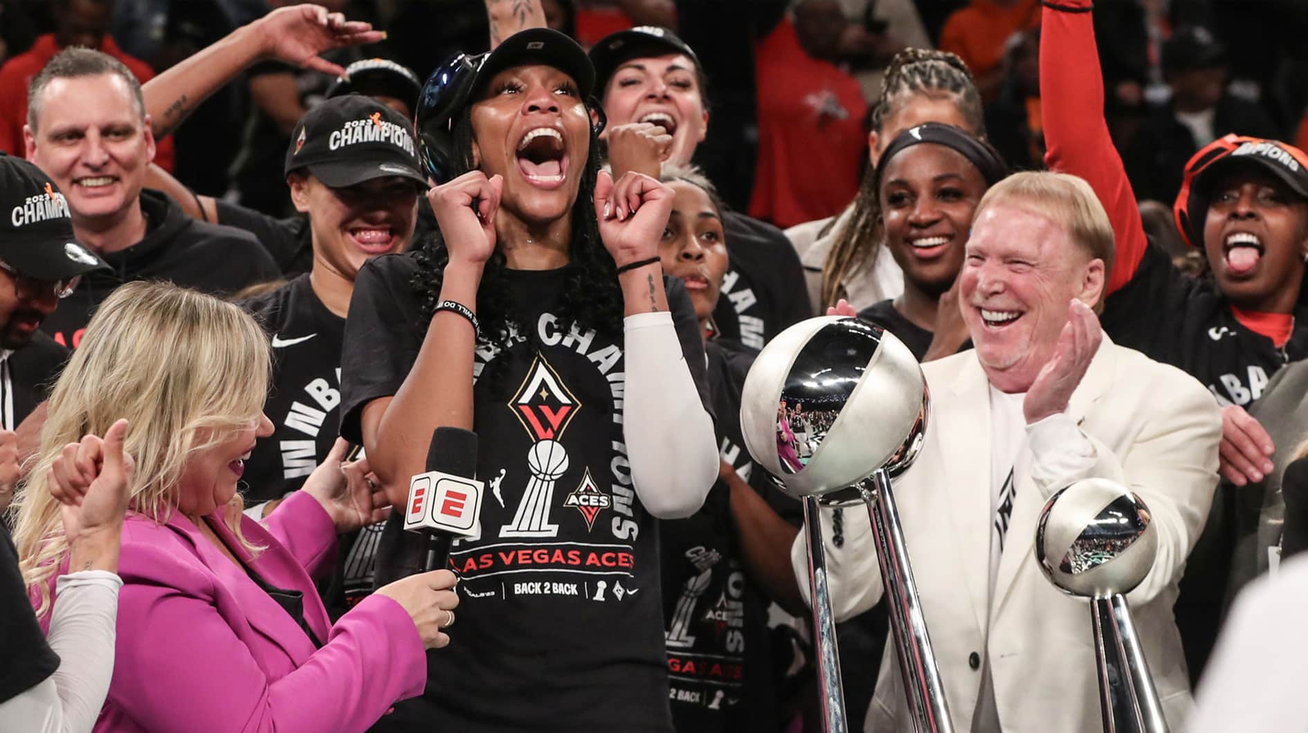 Las Vegas Aces forward A'ja Wilson (22) and owner Mark Davis celebrate after winning the 2023 WNBA Finals at Barclays Center.
