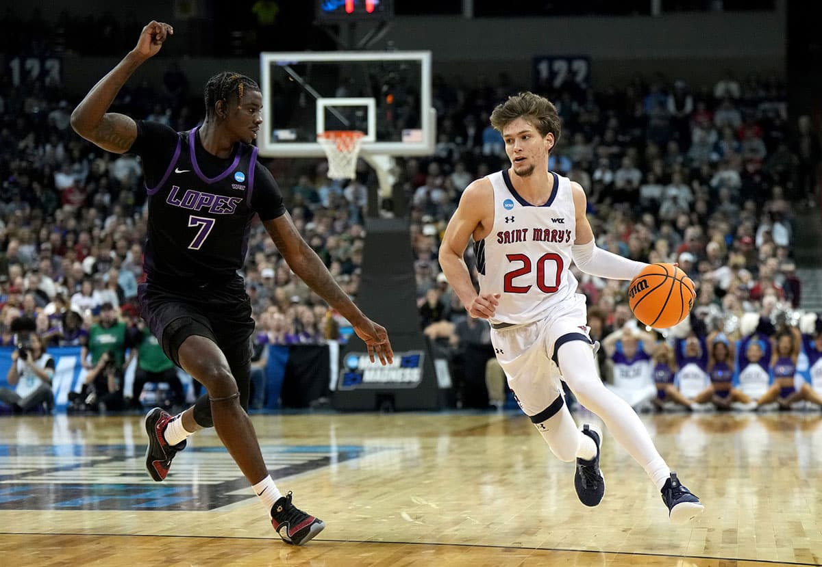 St. Mary's Gaels guard Aidan Mahaney (20) dribbles against Grand Canyon Antelopes guard Tyon Grant-Foster (7) during the second half in the first round of the 2024 NCAA Tournament at Spokane Veterans Memorial Arena.
