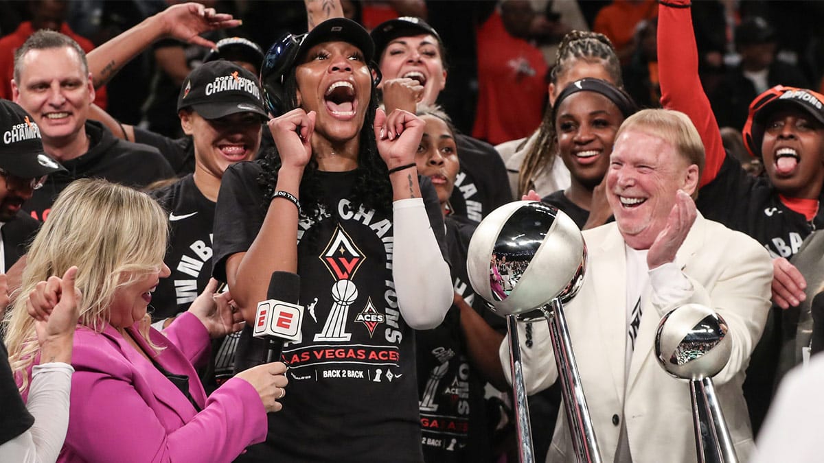 Las Vegas Aces forward A'ja Wilson (22) and owner Mark Davis celebrate after winning the 2023 WNBA Finals.