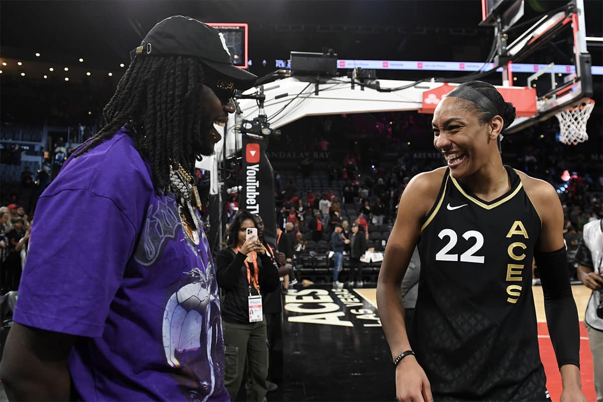 NBA player Montrezl Harrell laughs with Las Vegas Aces forward A'ja Wilson (22) after the game against the New York Liberty during game two of the 2023 WNBA Finals.