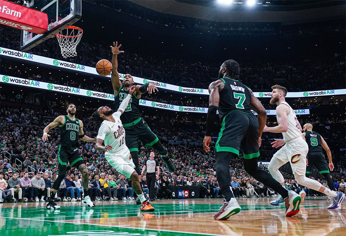 Boston Celtics center Al Horford (42) blocks the shot of Cleveland Cavaliers guard Darius Garland (10) in the second quarter during game five of the second round for the 2024 NBA playoffs at TD Garden.