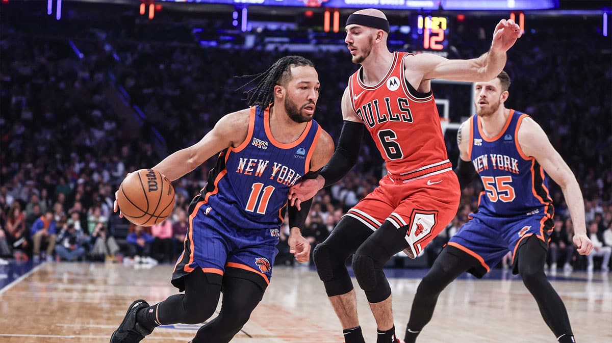 New York Knicks guard Jalen Brunson (11) drives past Chicago Bulls guard Alex Caruso (6) in the first quarter at Madison Square Garden.