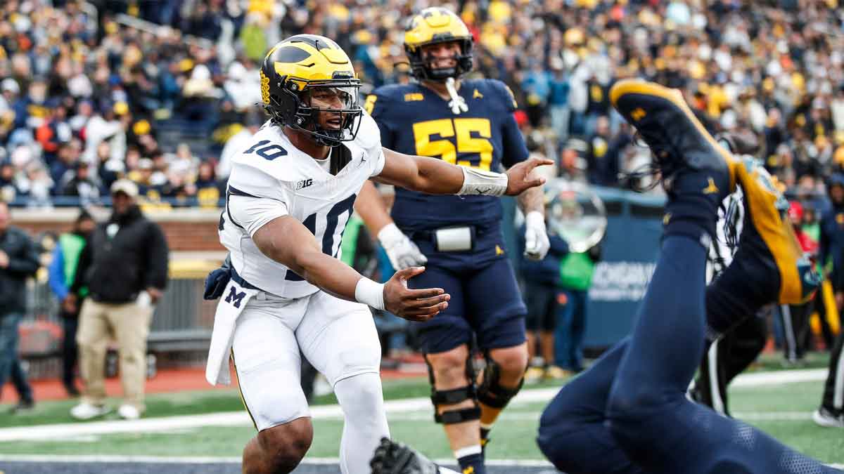 Blue Team quarterback Alex Orji (10) celebrates a touchdown against Maize Team during the first half of the spring game at Michigan Stadium