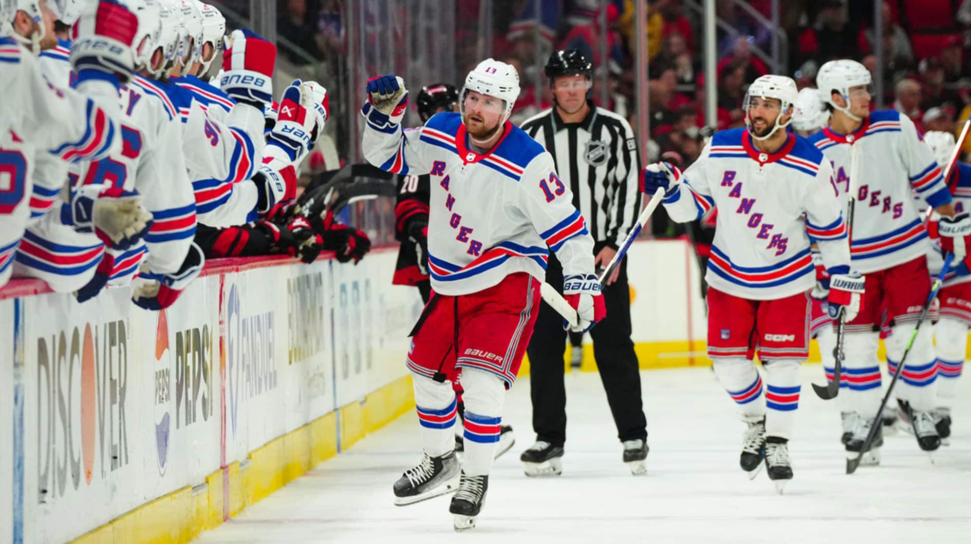 New York Rangers left wing Alexis Lafreniere (13) celebrates his goal against the Carolina Hurricanes during the third period in game three of the second round of the 2024 Stanley Cup Playoffs at PNC Arena.