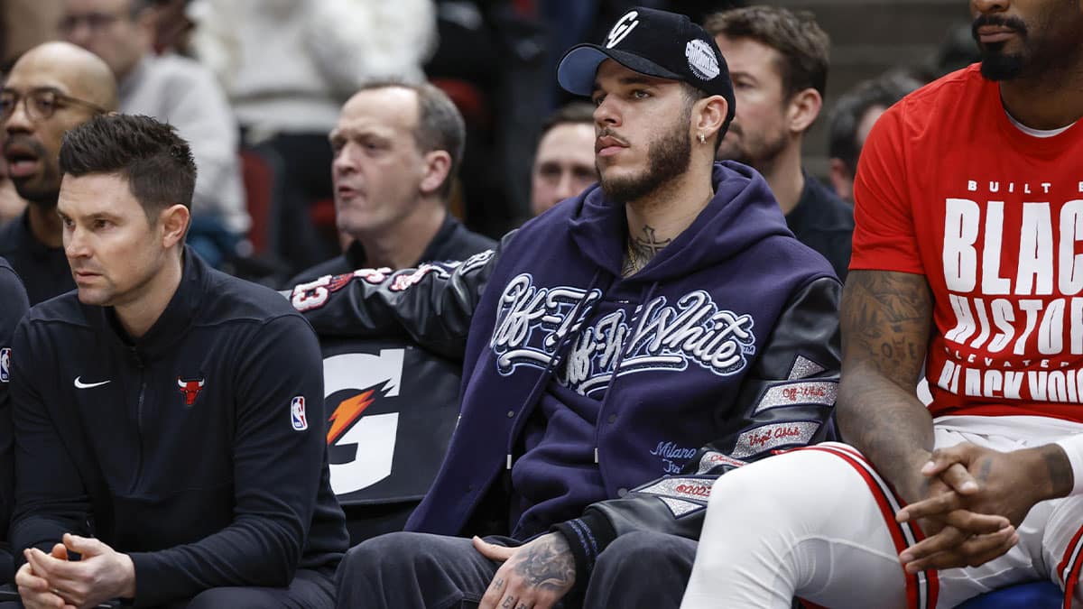 Injured Chicago Bulls guard Lonzo Ball (2) sits on the bench during the first half of a basketball game against the Sacramento Kings at United Center.