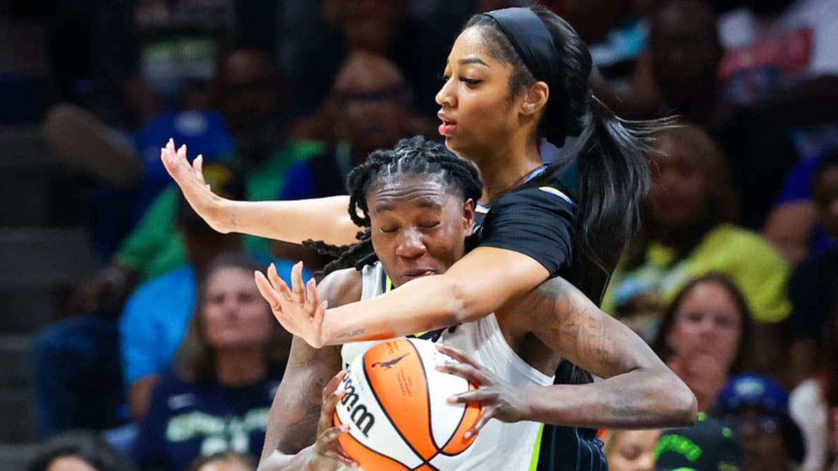 Dallas Wings forward Natasha Howard (6) looks to score as Chicago Sky forward Angel Reese (5) defends during the second half