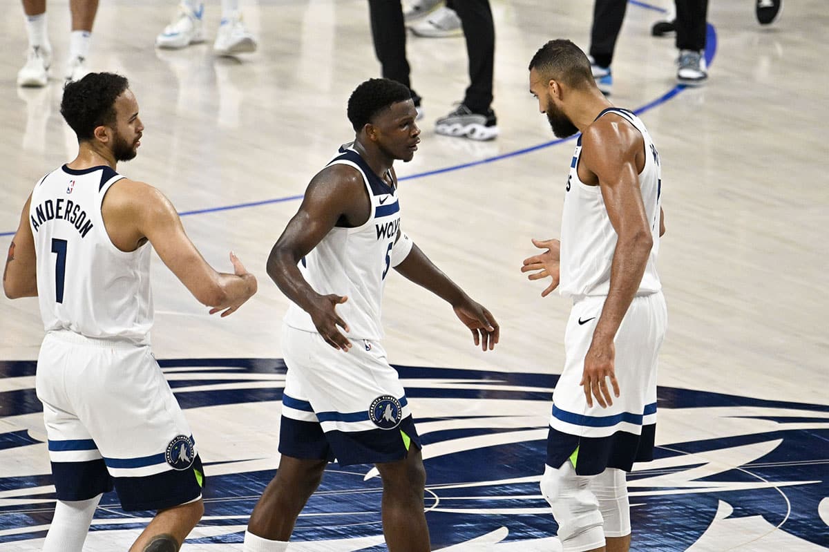 Minnesota Timberwolves forward Kyle Anderson (1) and guard Anthony Edwards (5) and center Rudy Gobert (27) during the second half against the Dallas Mavericks in game four of the western conference finals for the 2024 NBA playoffs at American Airlines Center. 