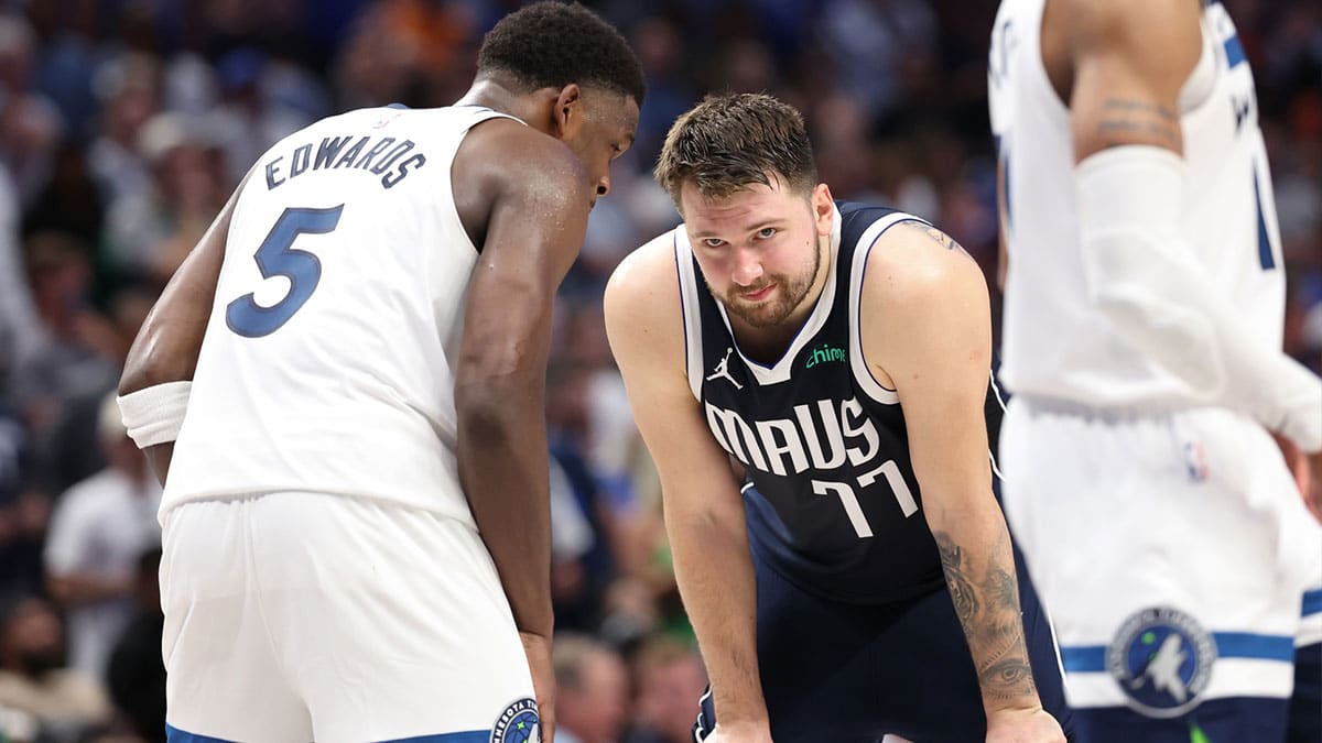 ; Minnesota Timberwolves guard Anthony Edwards (5) speaks to Dallas Mavericks guard Luka Doncic (77) during the fourth quarter of game four of the western conference finals for the 2024 NBA playoffs at American Airlines Center.