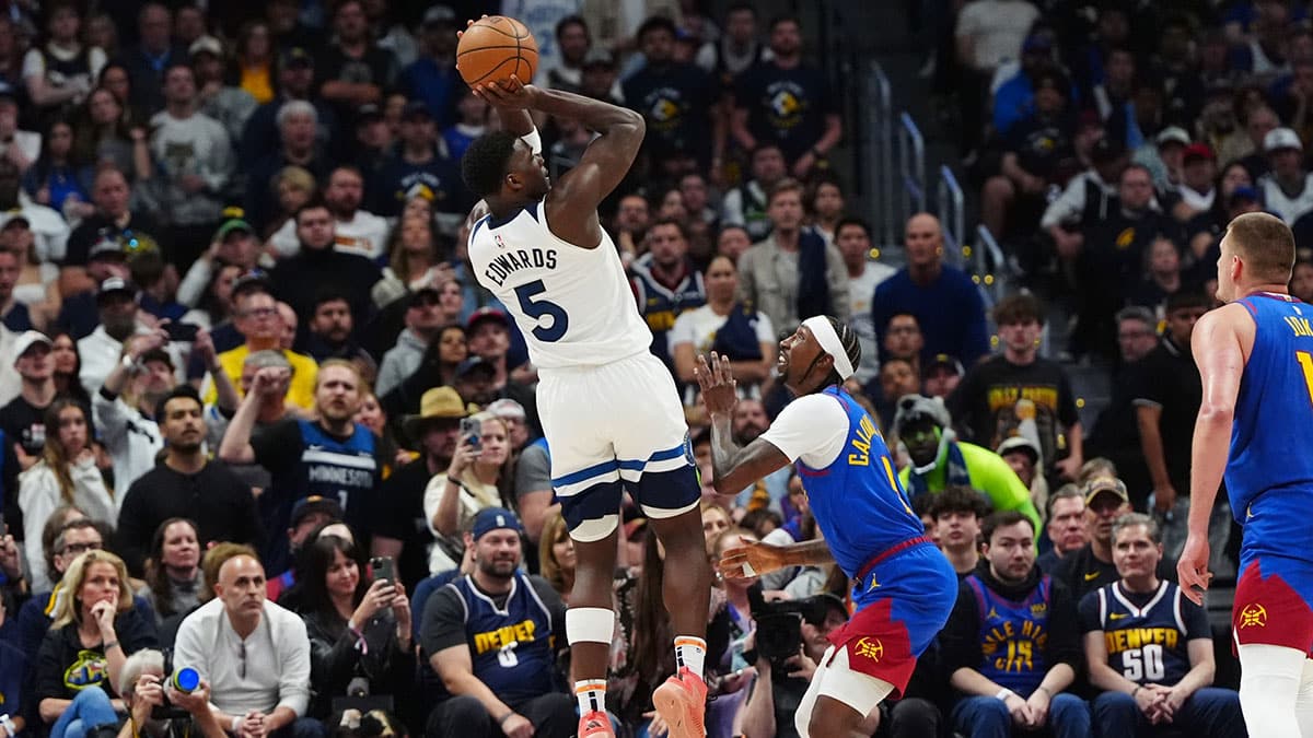 Minnesota Timberwolves guard Anthony Edwards (5) shoots the ball over Denver Nuggets guard Kentavious Caldwell-Pope (5)