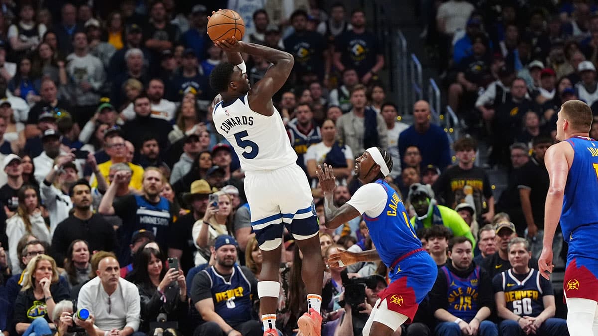 Minnesota Timberwolves guard Anthony Edwards (5) shoots the ball over Denver Nuggets guard Kentavious Caldwell-Pope (5) in the fourth quarter during game one of the second round for the 2024 NBA playoffs at Ball Arena