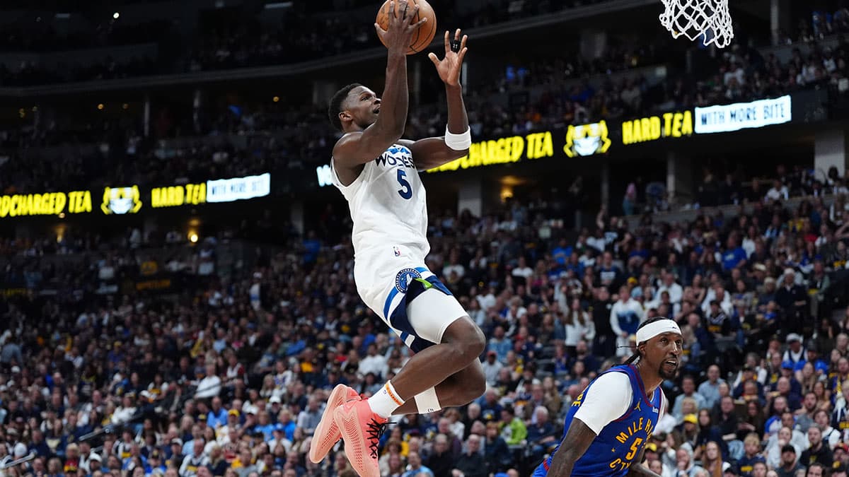 Minnesota Timberwolves guard Anthony Edwards (5) shoots over Denver Nuggets guard Kentavious Caldwell-Pope (5) in the second quarter during game one of the second round for the 2024 NBA playoffs at Ball Arena.