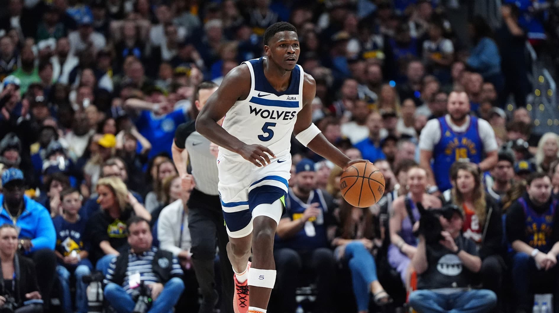 Minnesota Timberwolves guard Anthony Edwards (5) controls the ball in the second quarter against the Denver Nuggets during game one of the second round for the 2024 NBA playoffs at Ball Arena.