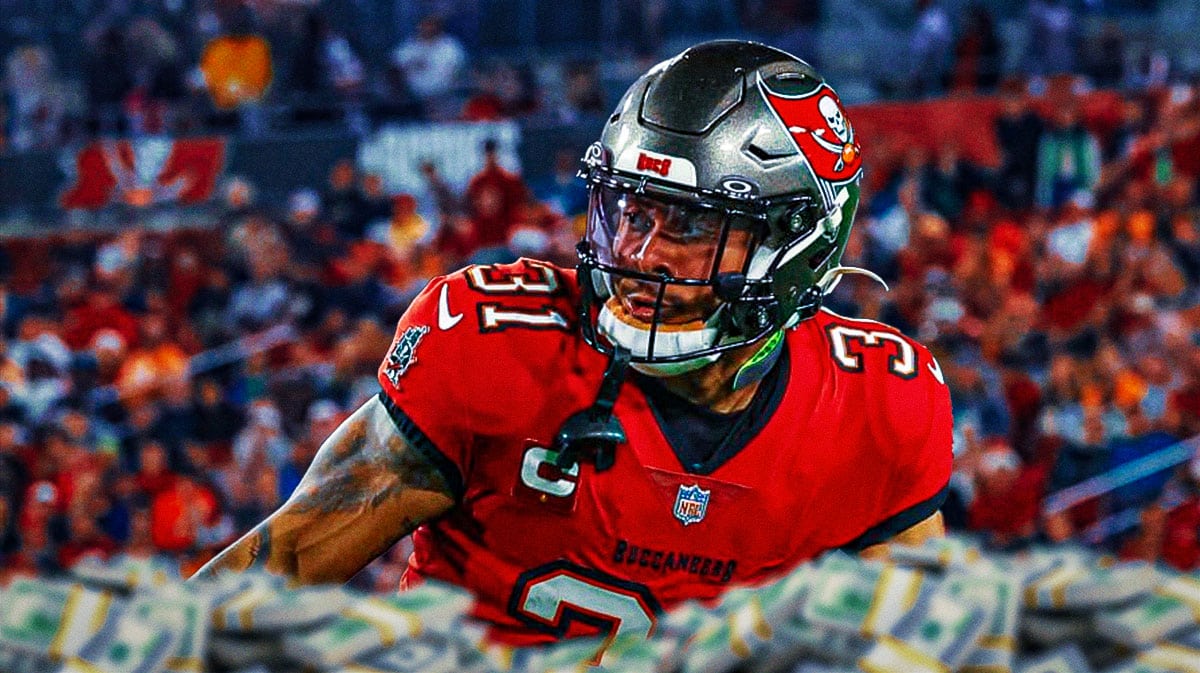 Antoine Winfield Jr. with money bags all around him