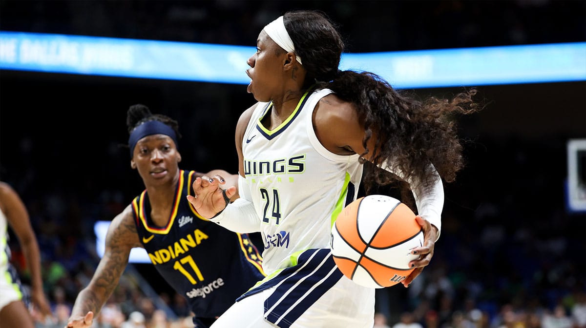 Dallas Wings guard Arike Ogunbowale (24) drives to the basket as Indiana Fever guard Erica Wheeler (17) defends during the second half at College Park Center.