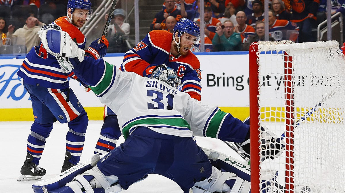 Vancouver Canucks goaltender Arturs Silovs (31) makes a save on on Edmonton Oilers forward Connor McDavid (97) during the third period in game three of the second round of the 2024 Stanley Cup Playoffs at Rogers Place.