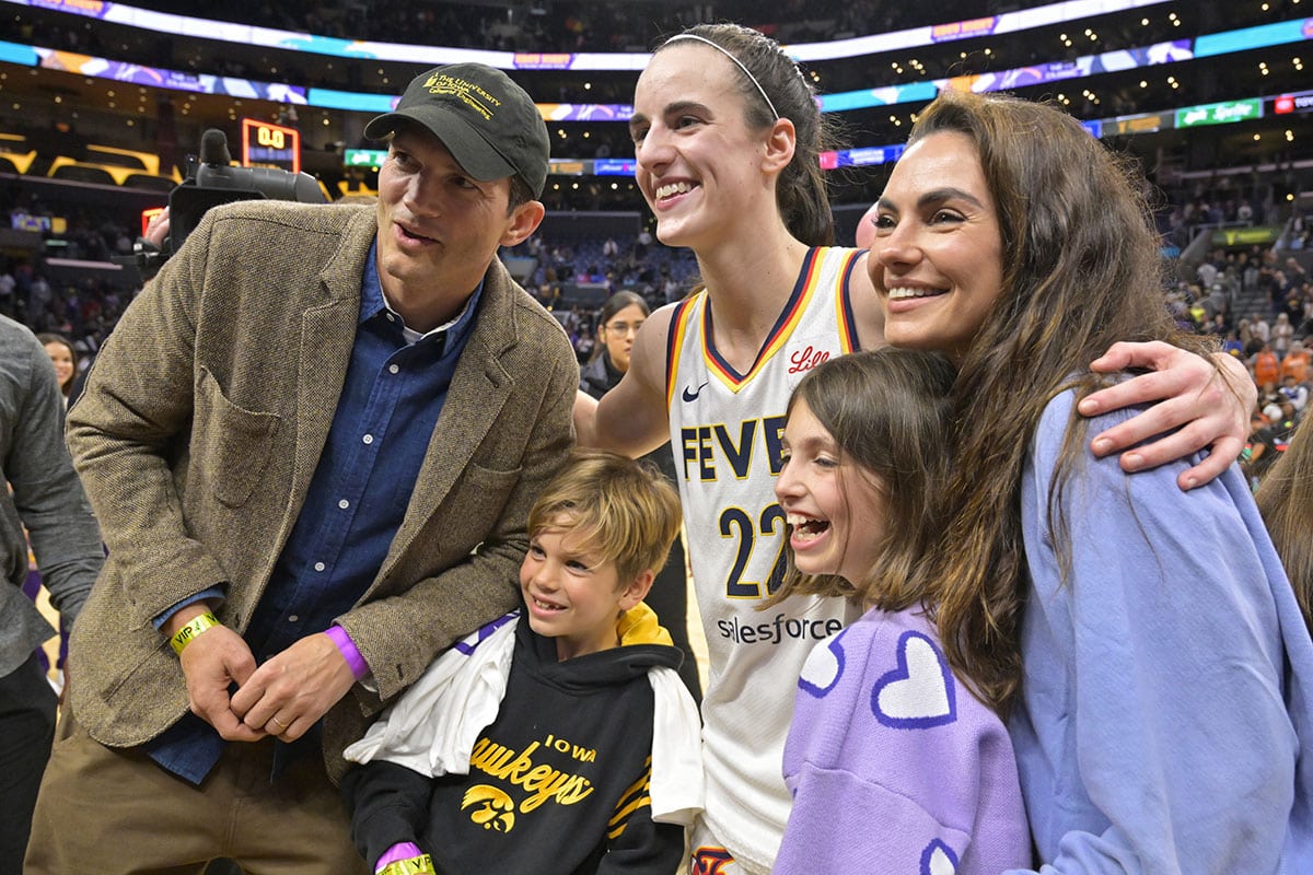 Ashton Kutcher and Mila Kunis with Caitlin Clark at an Indiana Fever game on May 24, 2024.