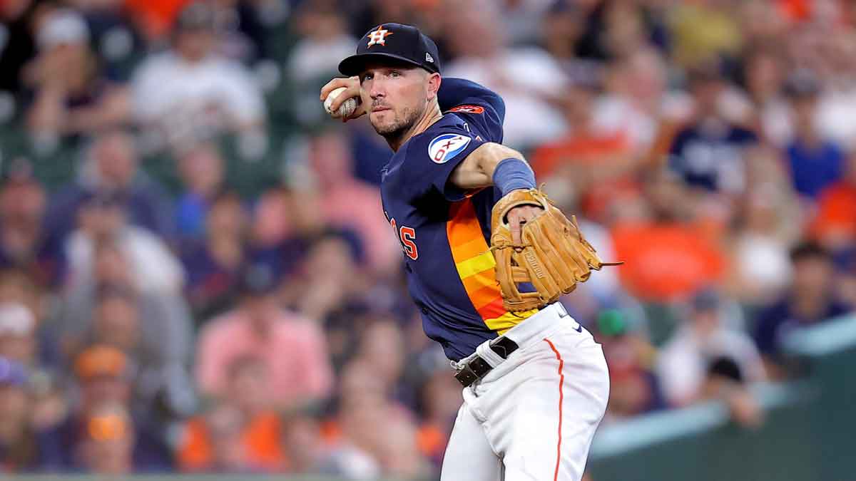 Houston Astros third baseman Alex Bregman (2) throws a fielded ball to first base for an out against the Seattle Mariners during the second inning at Minute Maid Park.