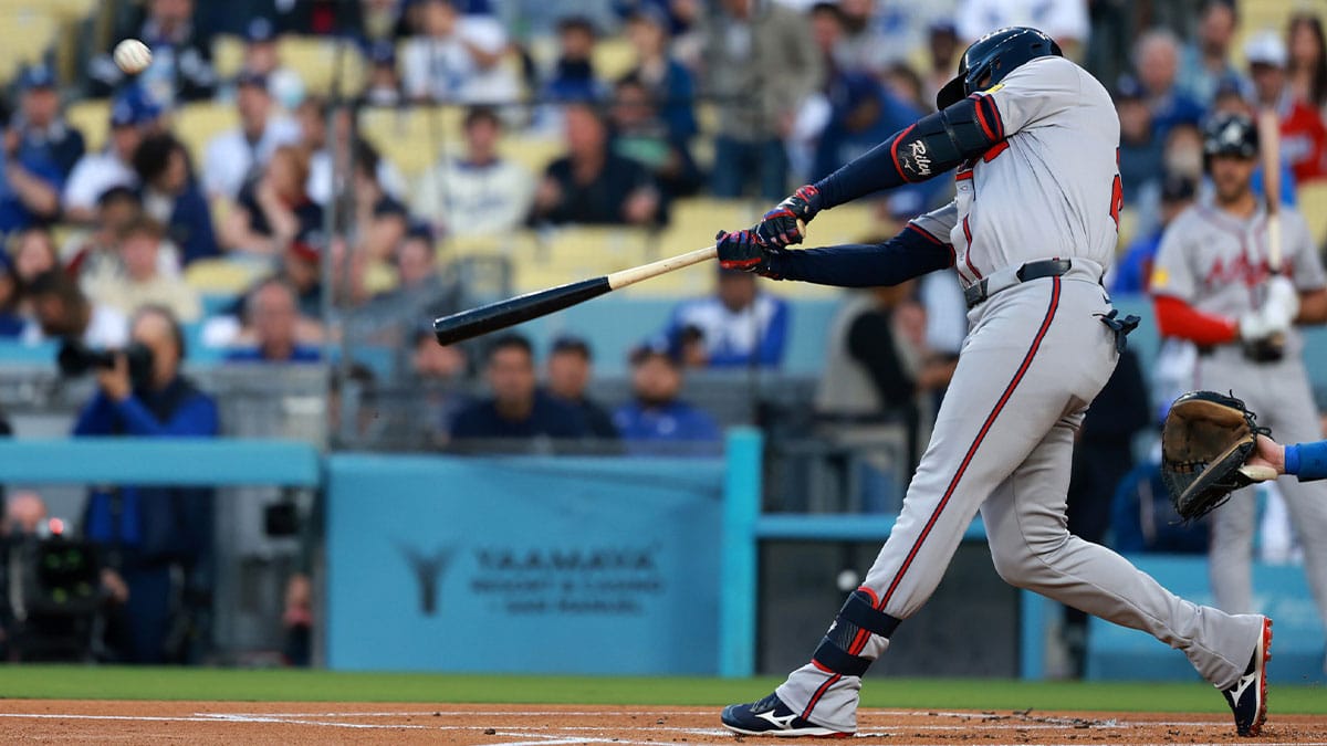 Atlanta Braves third base Austin Riley (27) hits a home run in the first inning against the Los Angeles Dodgers at Dodger Stadium. 