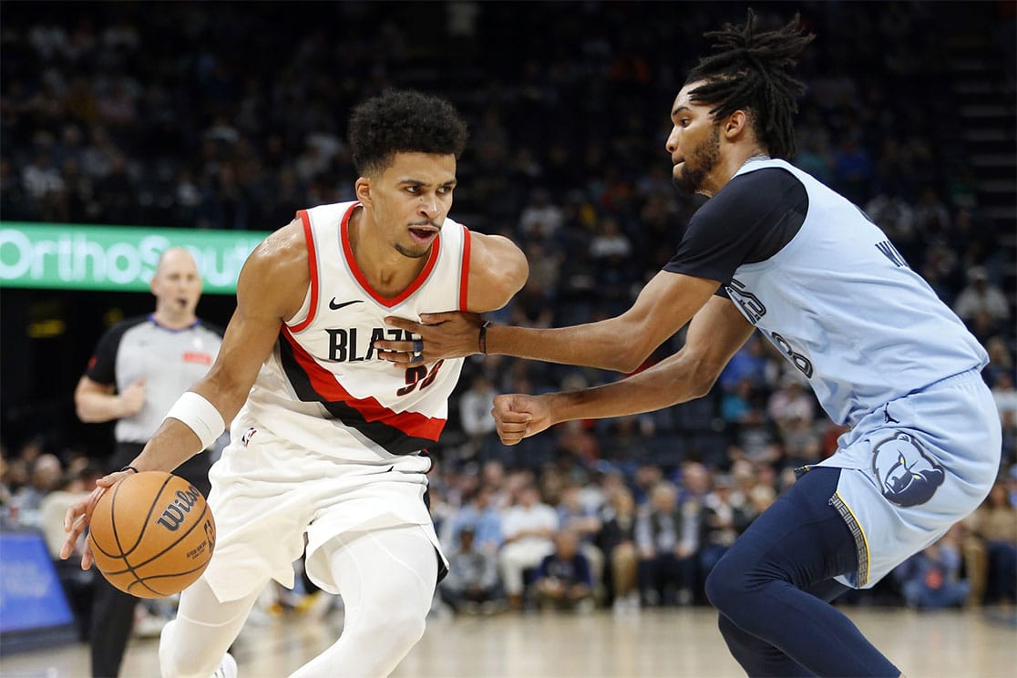 Portland Trail Blazers forward Toumani Camara (33) drives to the basket as Memphis Grizzlies forward Ziaire Williams (8) defends during the first half at FedExForum.