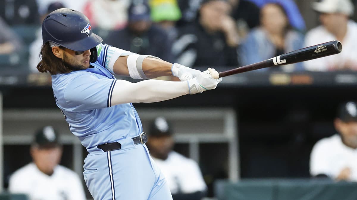 Toronto Blue Jays shortstop Bo Bichette (11) hits an RBI-single against the Chicago White Sox during the third inning at Guaranteed Rate Field.