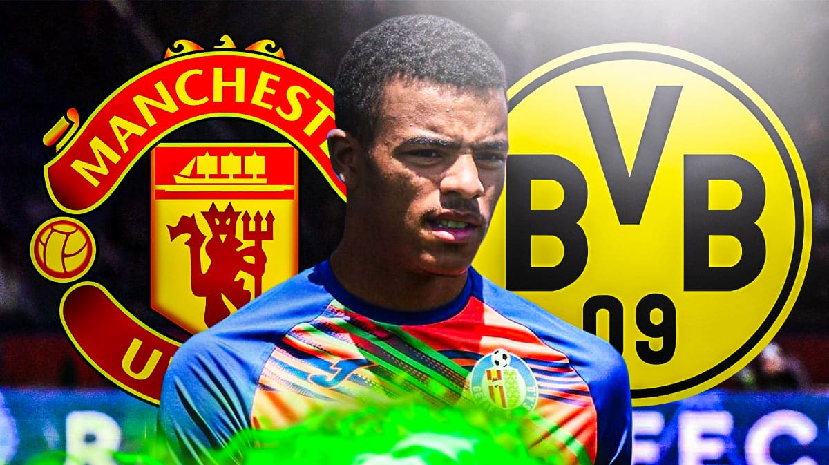 Mason Greenwood in front of the Manchester United and Borussia Dortmund logos