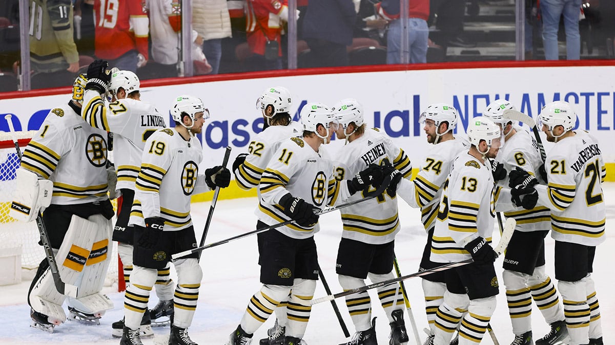  Boston Bruins players celebrate after winning against the Florida Panthers in game five of the second round of the 2024 Stanley Cup Playoffs at Amerant Bank Arena.