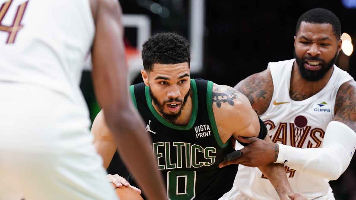 May 15, 2024; Boston, Massachusetts, USA; Boston Celtics forward Jayson Tatum (0) drivers the ball against Cleveland Cavaliers forward Marcus Morris Sr. (24) in the third quarter during game five of the second round for the 2024 NBA playoffs at TD Garden. Mandatory Credit: David Butler II-USA TODAY Sports