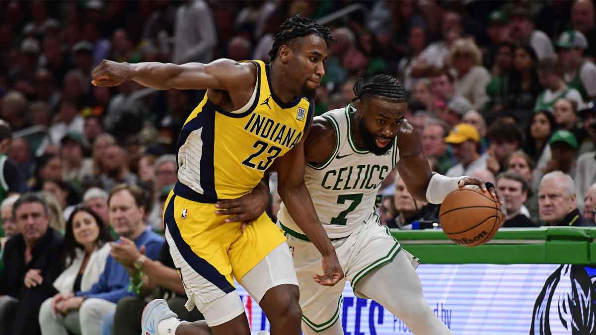 May 21, 2024; Boston, Massachusetts, USA; Boston Celtics guard Jaylen Brown (7) dribbles the ball past Indiana Pacers forward Aaron Nesmith (23) during the second half for game one of the eastern conference finals for the 2024 NBA playoffs at TD Garden. Mandatory Credit: Bob DeChiara-USA TODAY Sports