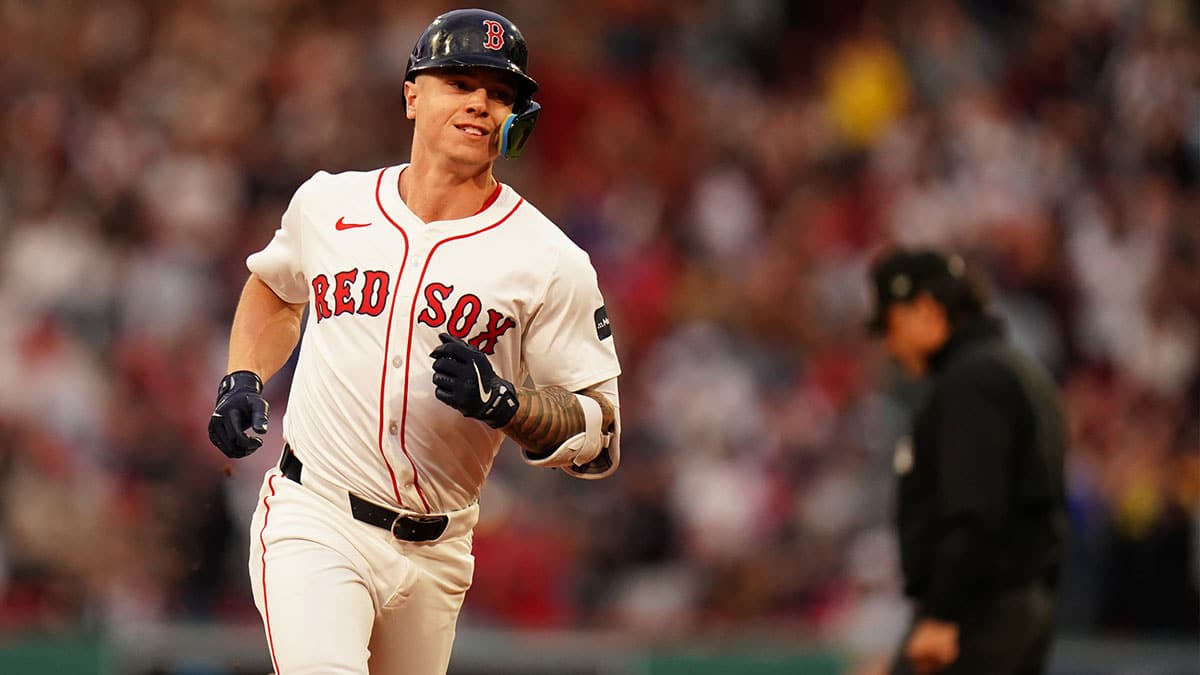 Boston Red Sox designated hitter Tyler O'Neill (17) hits a three run home run against the Tampa Bay Rays in the first inning at Fenway Park. 