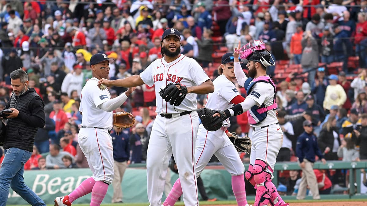 Boston Red Sox pitcher Kenley Jansen (74) and catcher Connor Wong (12) react to the win against the Washington Nationals at Fenway Park.