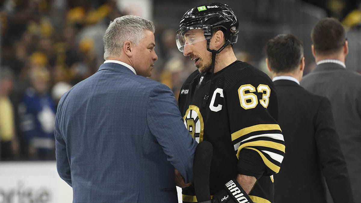 Toronto Maple Leafs coach Sheldon Keefe and Boston Bruins left wing Brad Marchand (63) speak after the game in game seven of the first round of the 2024 Stanley Cup Playoffs at TD Garden.