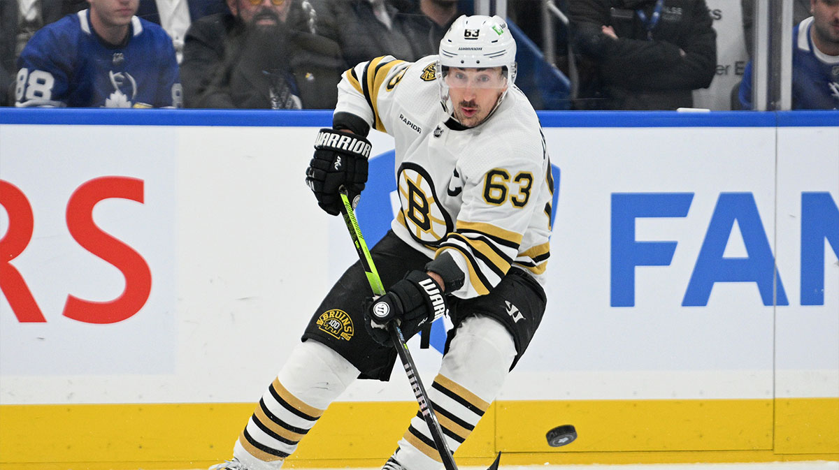 Boston Bruins forward Brad Marchand (63) passes the puck against the Toronto Maple Leafs in the first period in game six of the first round of the 2024 Stanley Cup Playoffs at Scotiabank Arena.