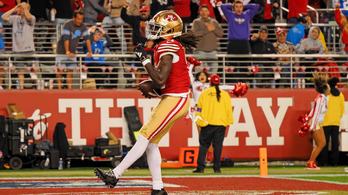 San Francisco 49ers wide receiver Brandon Aiyuk (11) reacts after catching a ball that bounced off the face mask of Detroit Lions cornerback Kindle Vildor (not pictured) during the second half of the NFC Championship football game at Levi's Stadium.