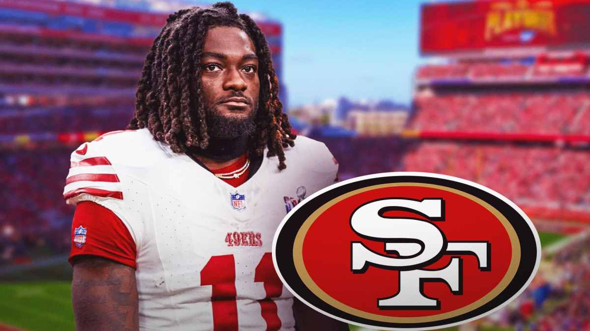 49ers' Brandon Aiyuk looks at contract reporters during OTA
