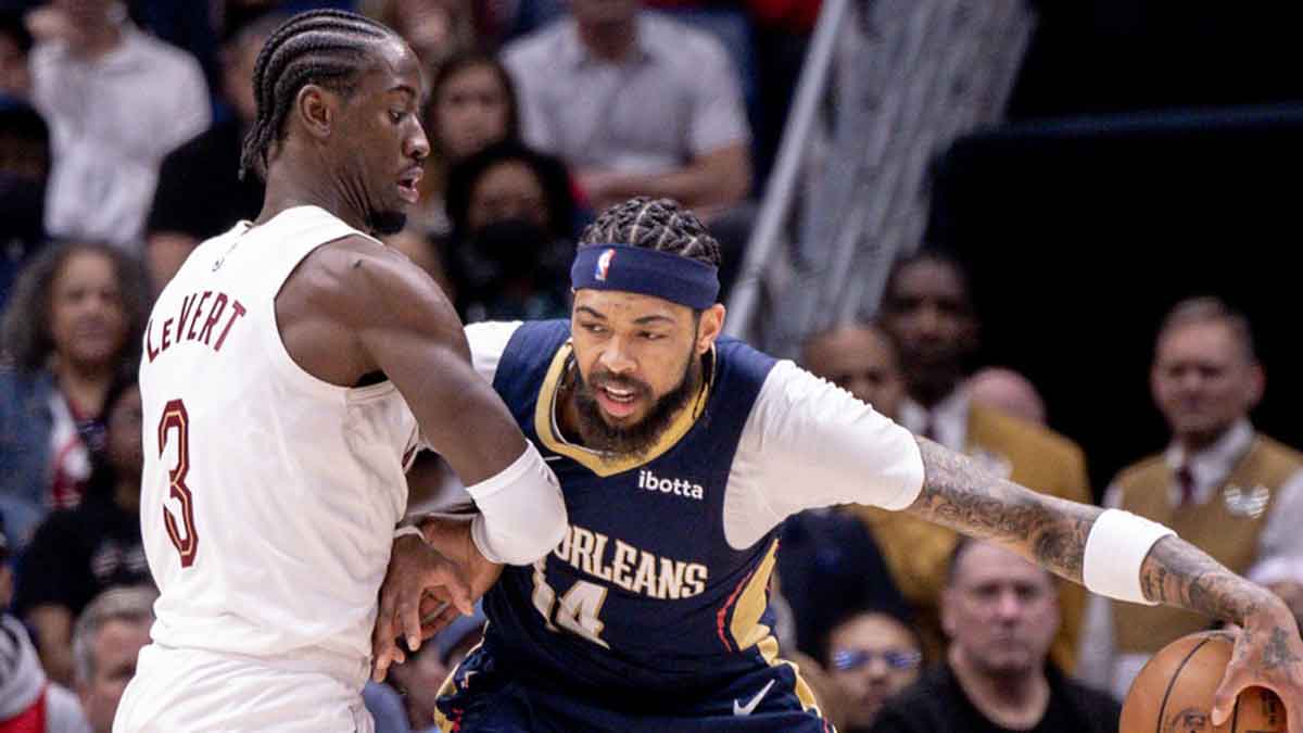 New Orleans Pelicans forward Brandon Ingram (14) dribbles against Cleveland Cavaliers guard Caris LeVert (3) during the first half at Smoothie King Center.