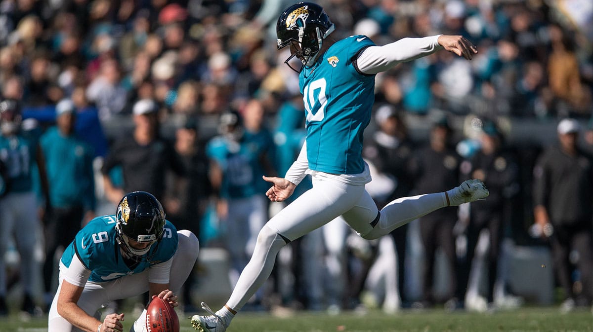 Jacksonville Jaguars punter Logan Cooke (9) holds the ball andnkicker Brandon McManus (10) make the field goal against the Carolina Panthers in the second quarter at EverBank Stadium.