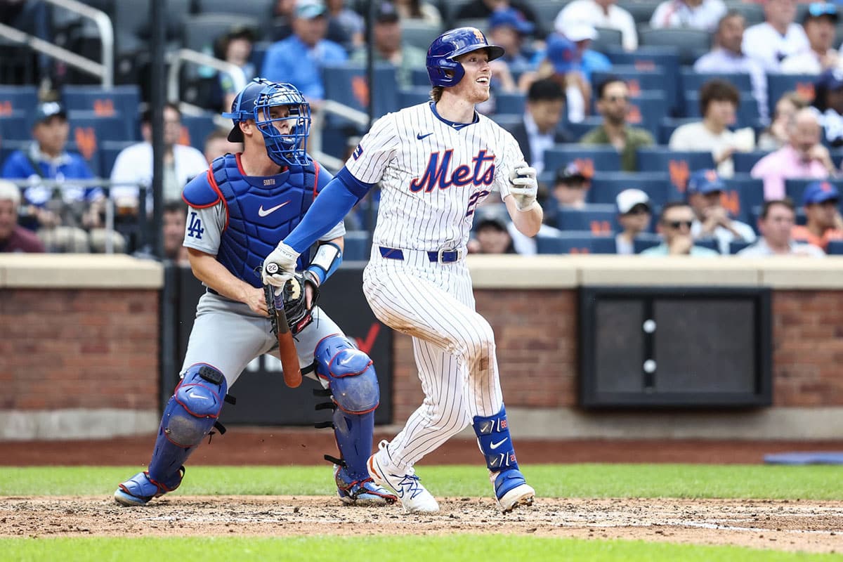 New York Mets third base Brett Baty (22) hits a single in the third inning against the Los Angeles Dodgers at Citi Field.