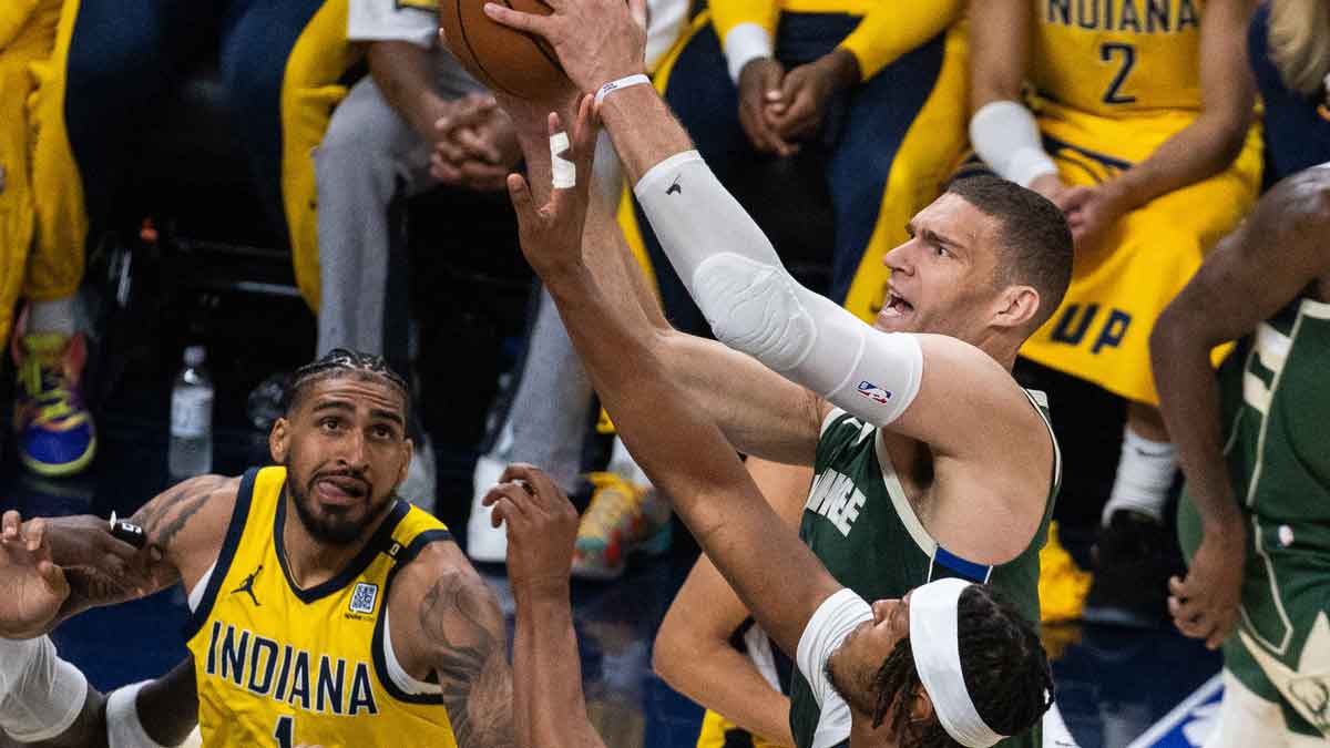 Milwaukee Bucks center Brook Lopez (11) shoots the ball while Indiana Pacers center Myles Turner (33) defends during game six of the first round for the 2024 NBA playoffs at Gainbridge Fieldhouse