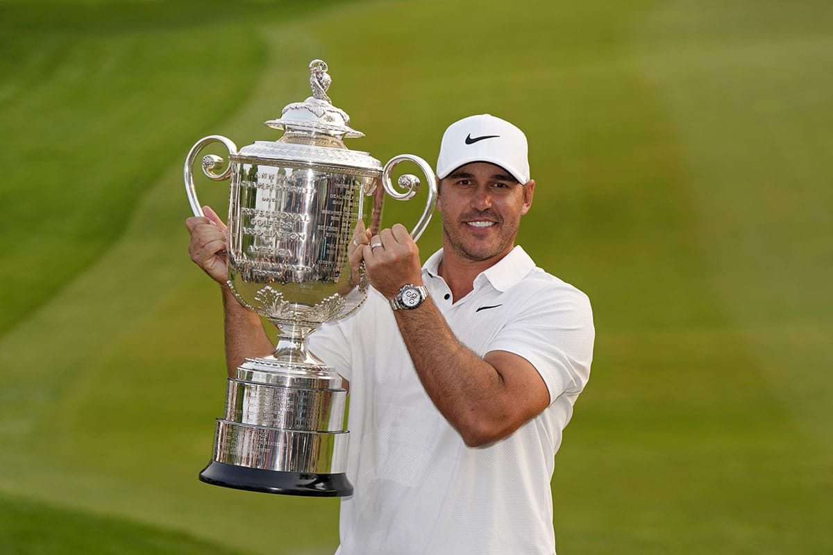 Brooks Koepka poses with the Wanamaker Trophy after winning the PGA Championship golf tournament at Oak Hill Country Club