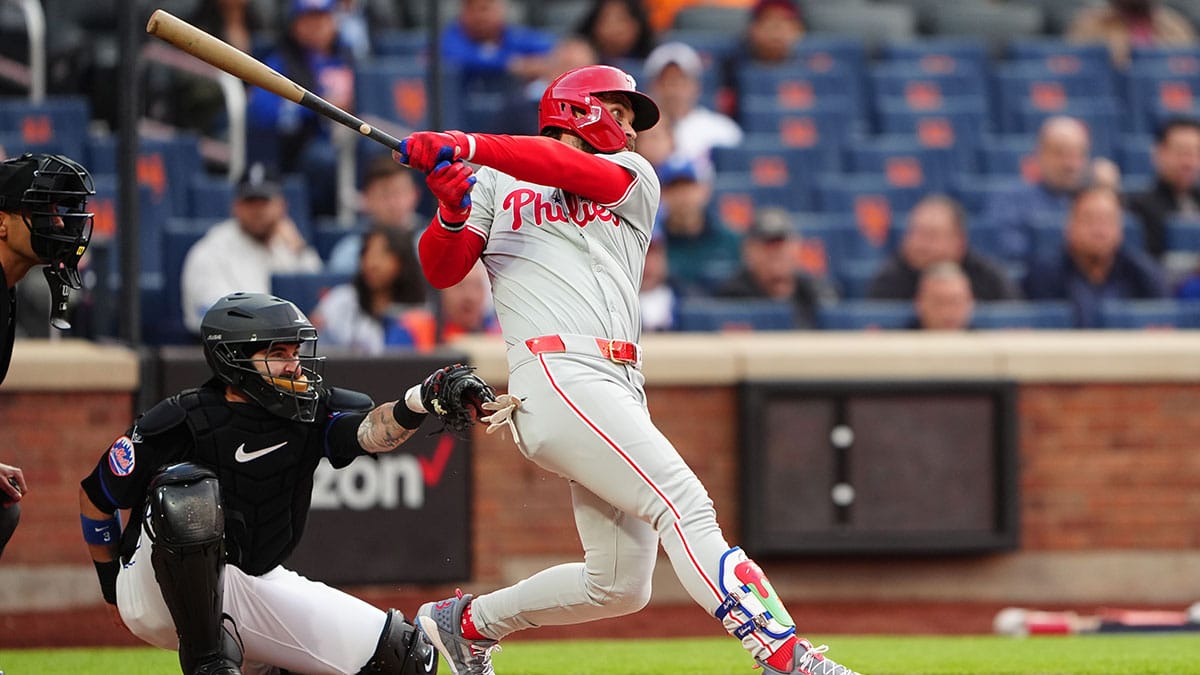 Philadelphia Phillies first baseman Bryce Harper (3) hits a single against the New York Mets during the first inning at Citi Field.
