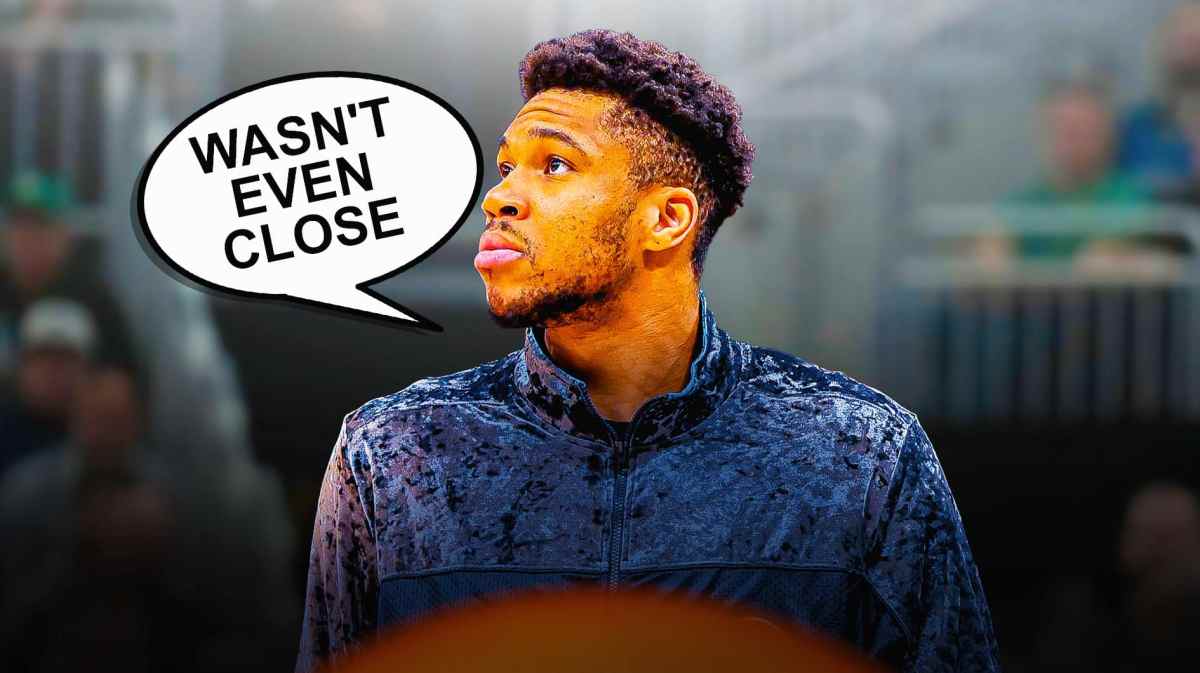 Photo: Giannis Antetokounmpo saying "Wasn't even close" looking disappointed sitting on the bench in Bucks gear