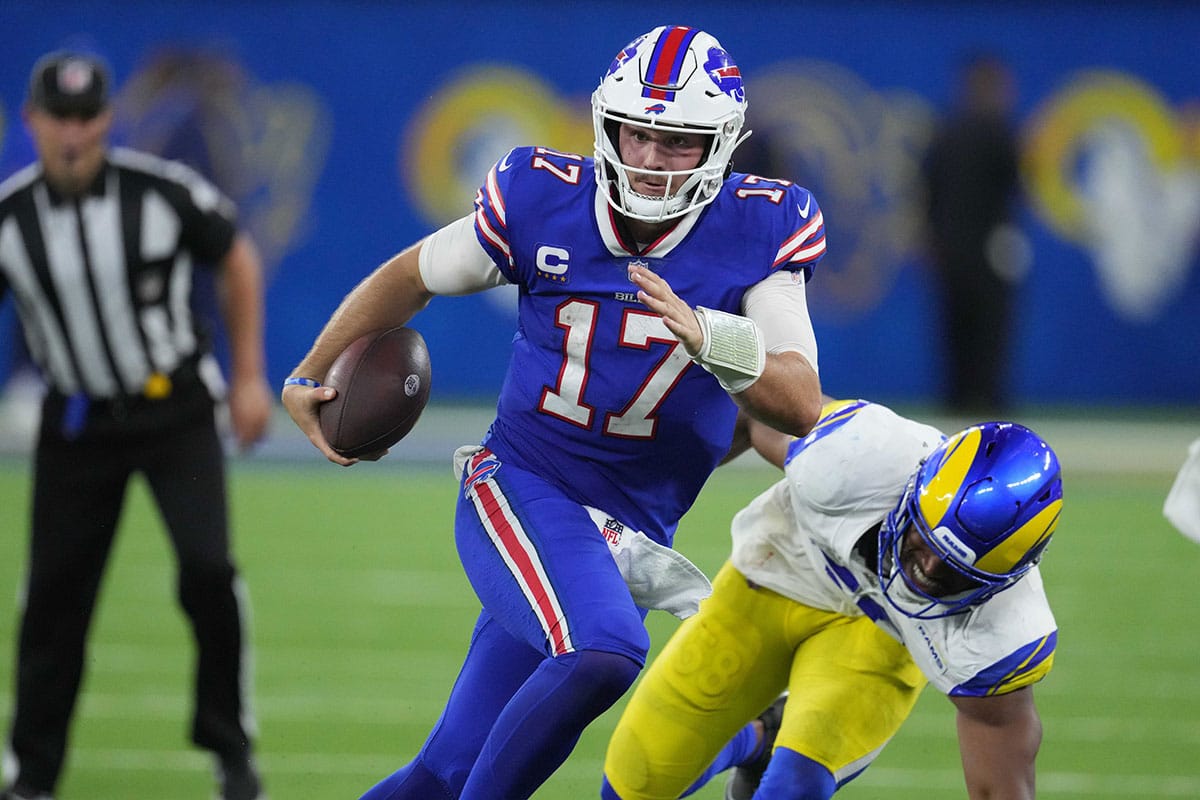 Buffalo Bills quarterback Josh Allen (17) carries the ball against the Los Angeles Rams at SoFi Stadium. The Bills defeated the Rams 31-10. 