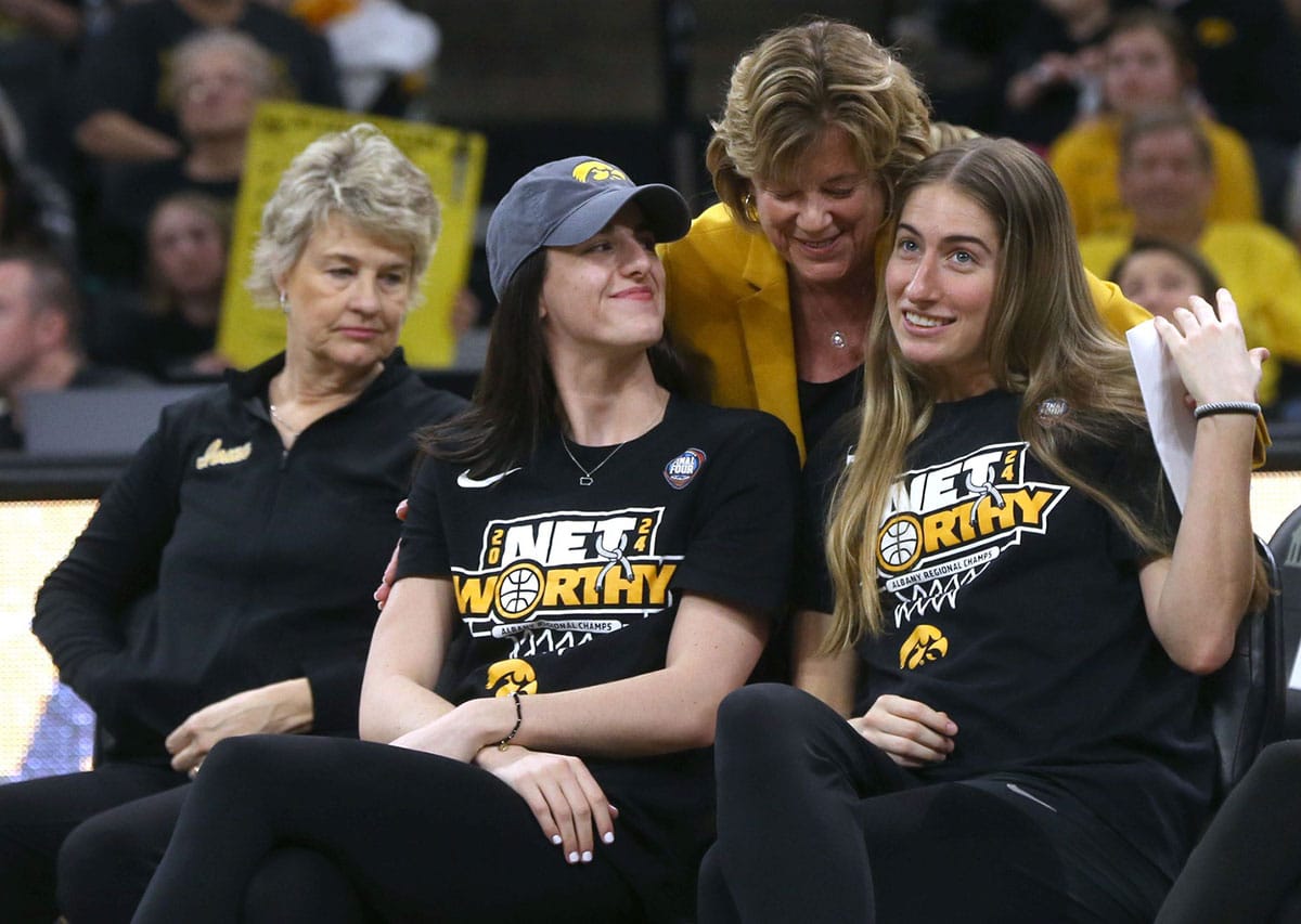 owa president Barbara Wilson hugs Caitlin Clark, left, and Kate Martin during a celebration of the Iowa women’s basketball team Wednesday, April 10, 2024 at Carver-Hawkeye Arena in Iowa City, Iowa.