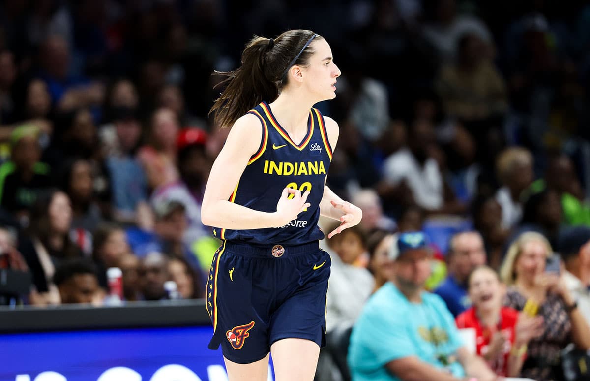 Indiana Fever guard Caitlin Clark (22) reacts after scoring during the second half against the Dallas Wings.