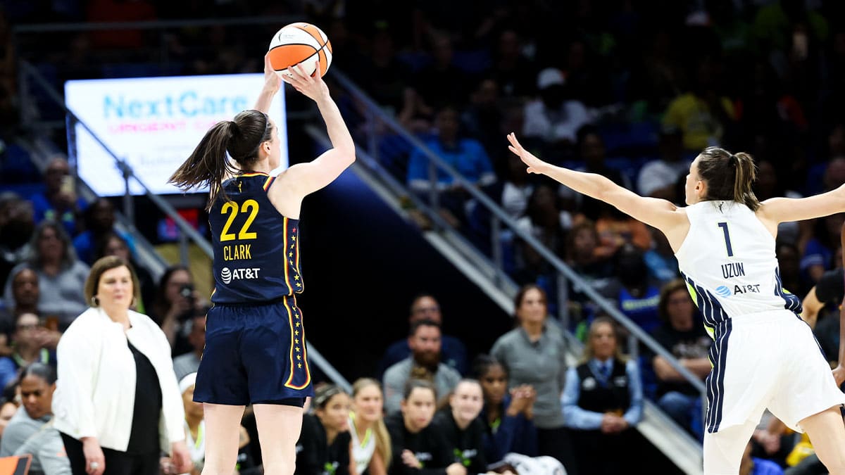 Indiana Fever guard Caitlin Clark (22) shoots over Dallas Wings guard Ashley Joens (1) during the second half at College Park Center.