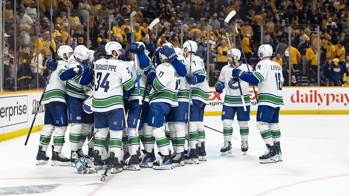 Vancouver Canucks celebrate the win against the Nashville Predators during game six of the first round of the 2024 Stanley Cup Playoffs at Bridgestone Arena.